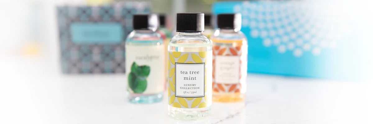 Fragrance bottles on counter with blurred boxes behind