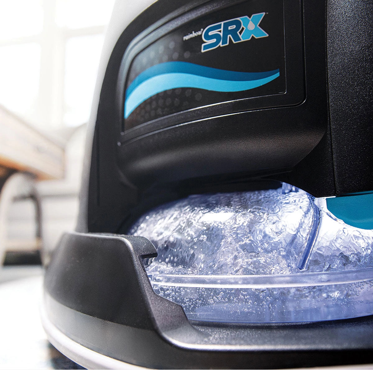 Close-up of Rainbow SRX water basin lit up with water swirling