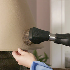 Dusting Brush on a dusty lamp shade