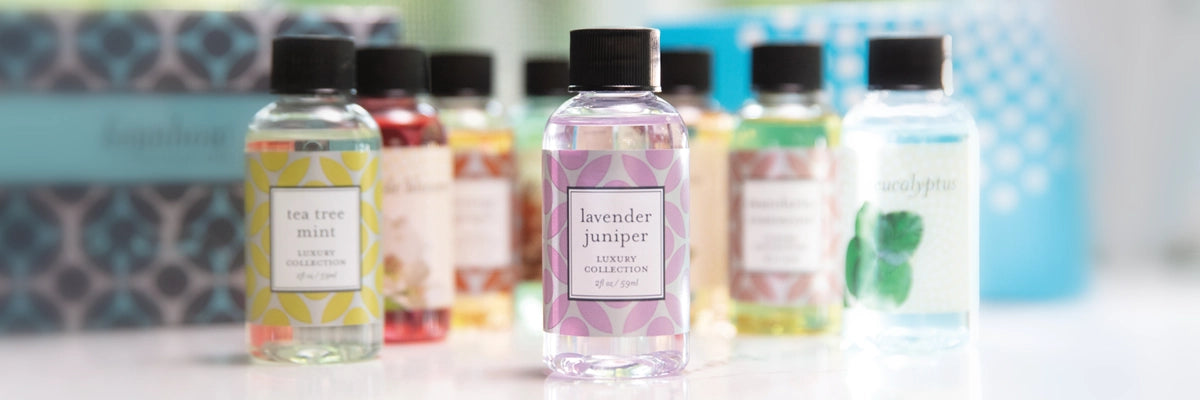 Set of small bottles with labels on a blurred background