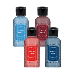 Four bottles of 'Winter' collection products with colorful labels on a white background
